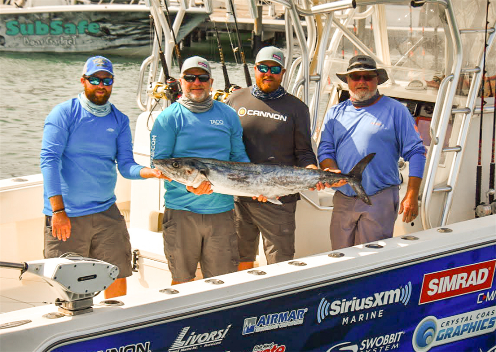 Liquid Fire Fishing Team posing with a fish while filming their new TV show Troll The Edge.